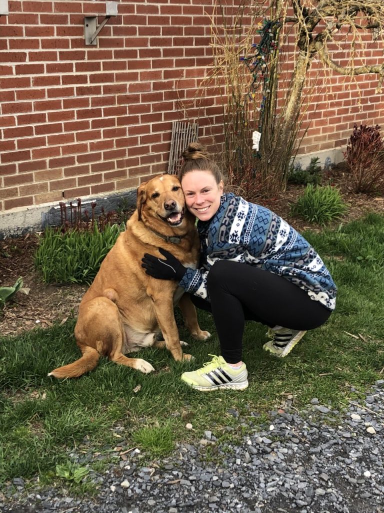 Ottawa chiropractor with a friendly dog outdoors.