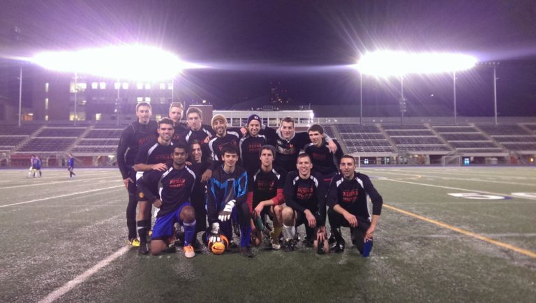 Team photo at night on soccer field