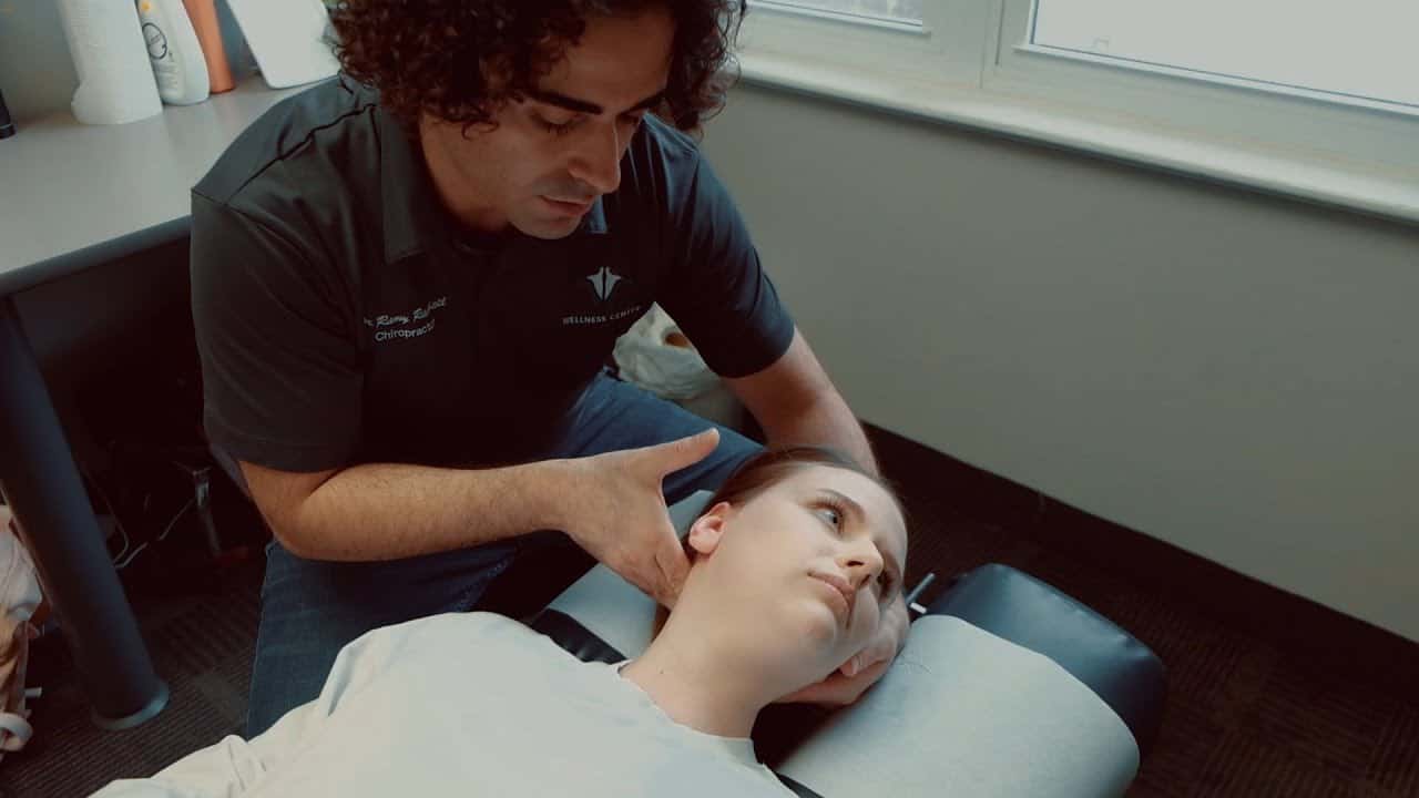 Best Chiropractor Ottawa: How to Choose the Right Clinic (And Book With Confidence) 8 Chiropractor performing a neck adjustment on patient.