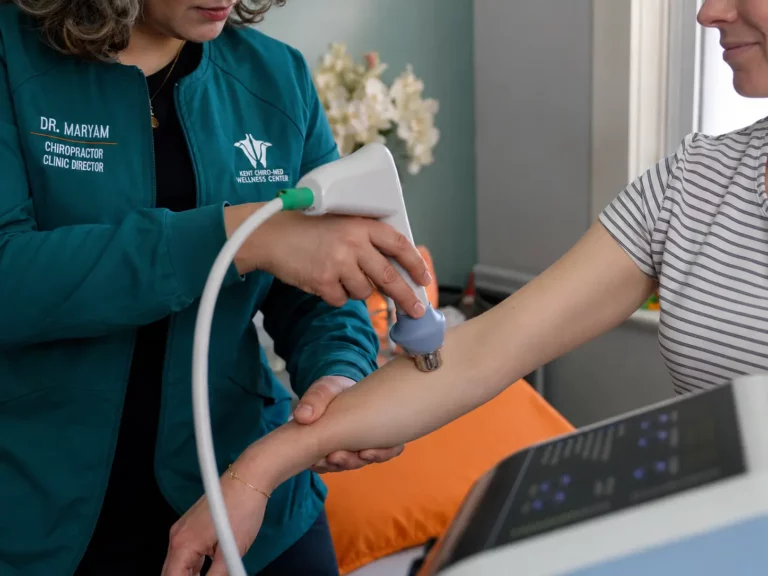 Maryam Arm and leg pain relief therapy using treatment equipment at Kent Chiro Med Wellness Clinic in Ottawa