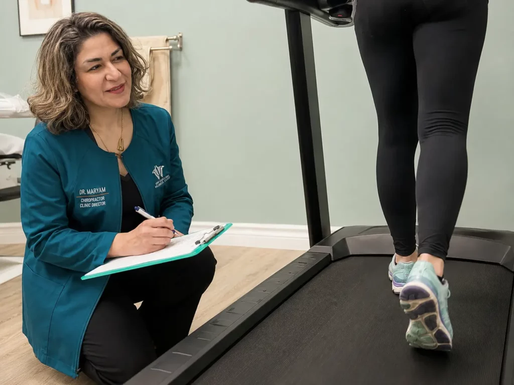 Dr. Maryam observing a patients walking pattern during unsteady gait treatment and balance therapy in Ottawa