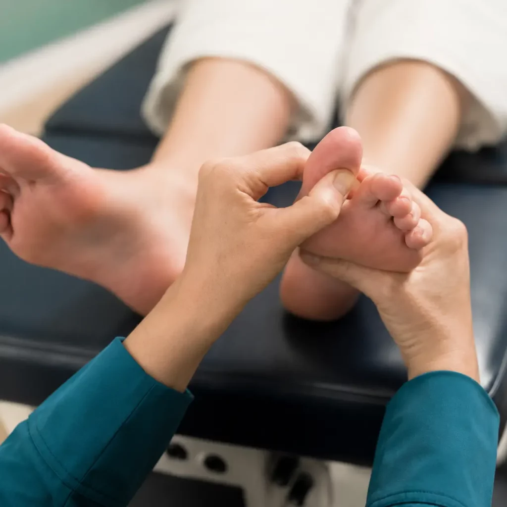 Kent Chiro Med practitioner assessing a patients big toe joint during bunion treatment in Ottawawebp